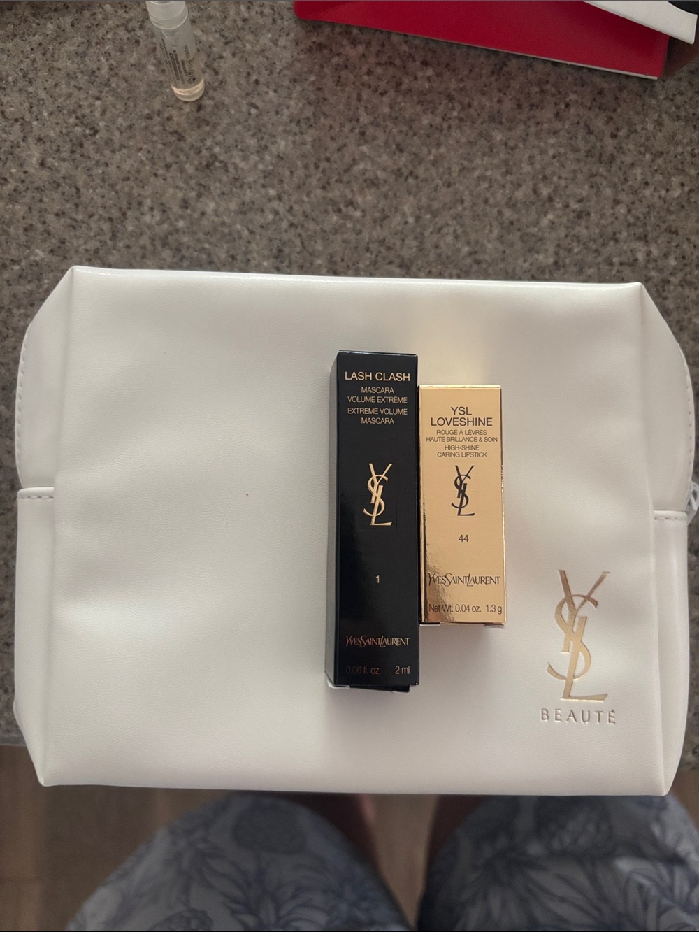 Yves Saint Laurent White Makeup Pouch with lipstick and mascara